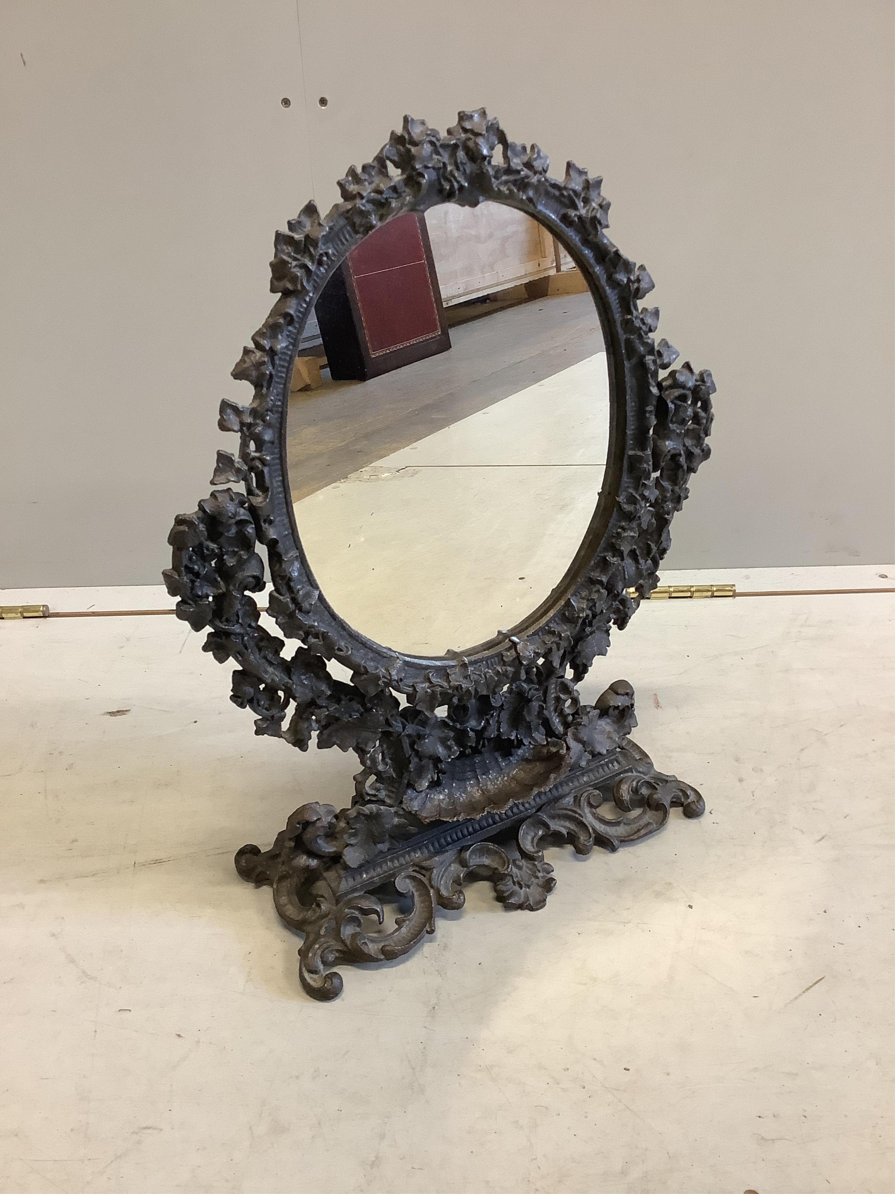 An early 20th century cast iron dressing table mirror, width 38cm, height 49cm. Condition - fair